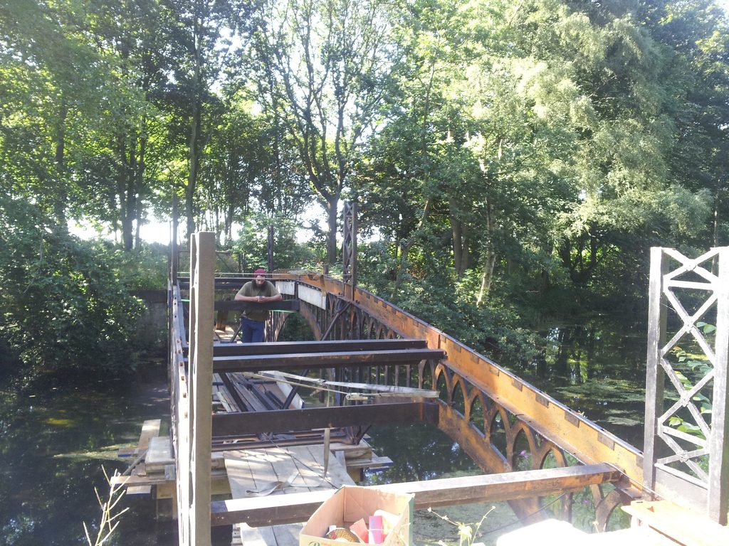 Cast-iron bridge structure during reconstruction following recovery of the original sections